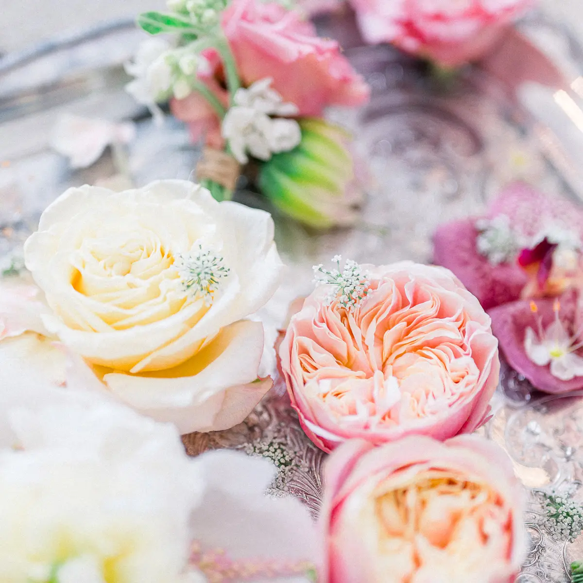 Pastel roses floral composition for wedding at Château Soutard – editorial style